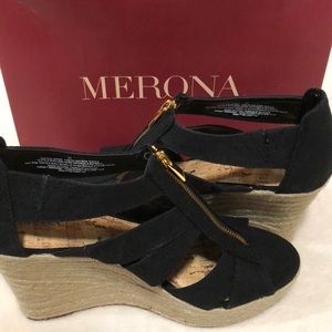 black wedges,with a gold zipper.